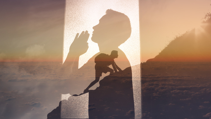 Young man praying to god for strength to get through difficult times